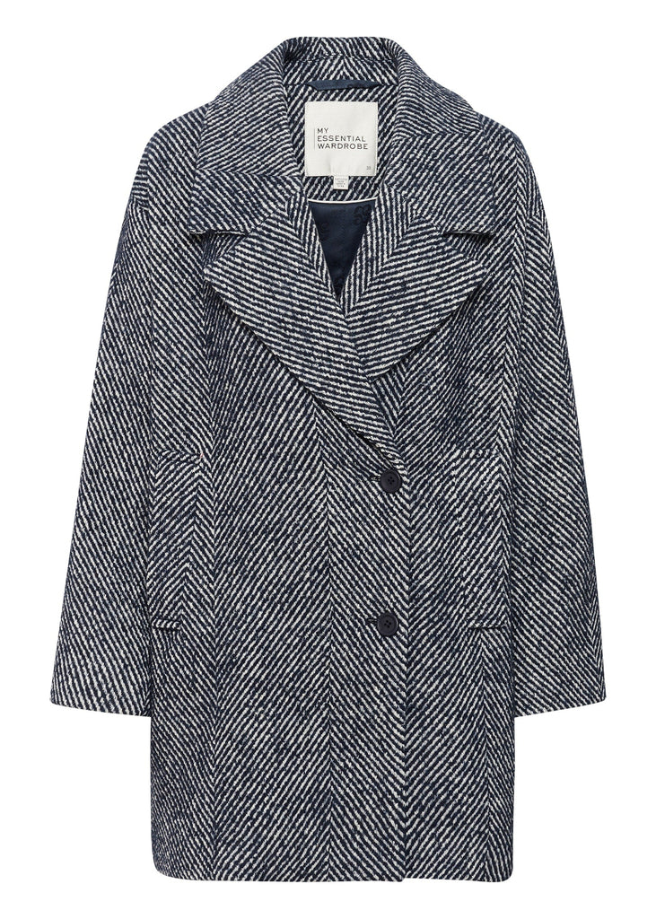 Herringbone patterned coat on a white background