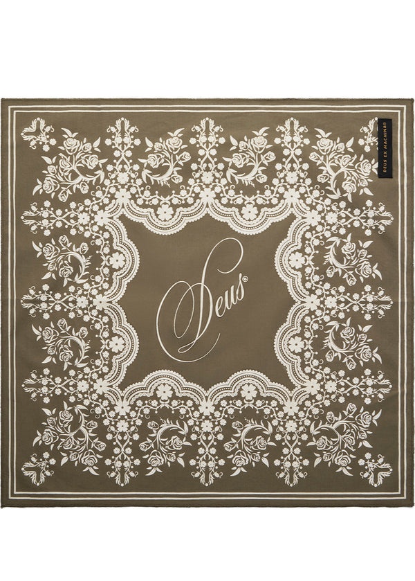 Decorative brown mat with white lace pattern and 'Sews' text on a white background