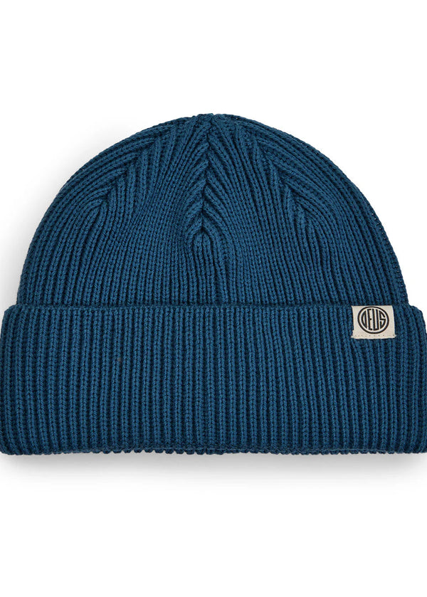 Blue knit beanie with a brand logo on a white background