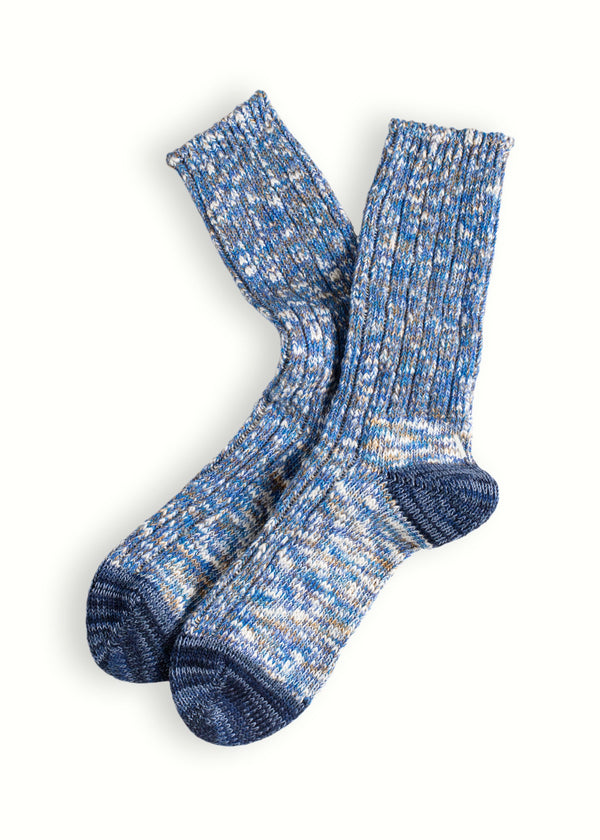 Pair of blue and gray patterned socks on a white background