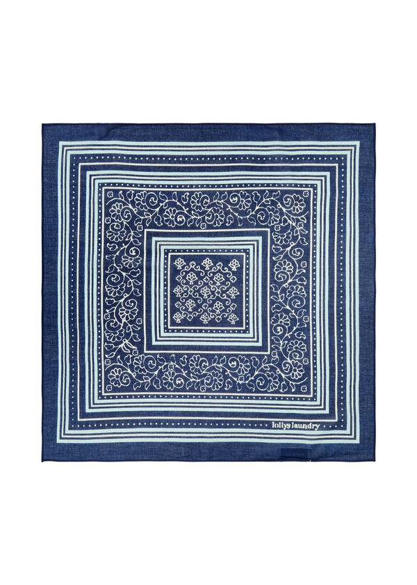 Navy blue bandana with white patterns on a white background