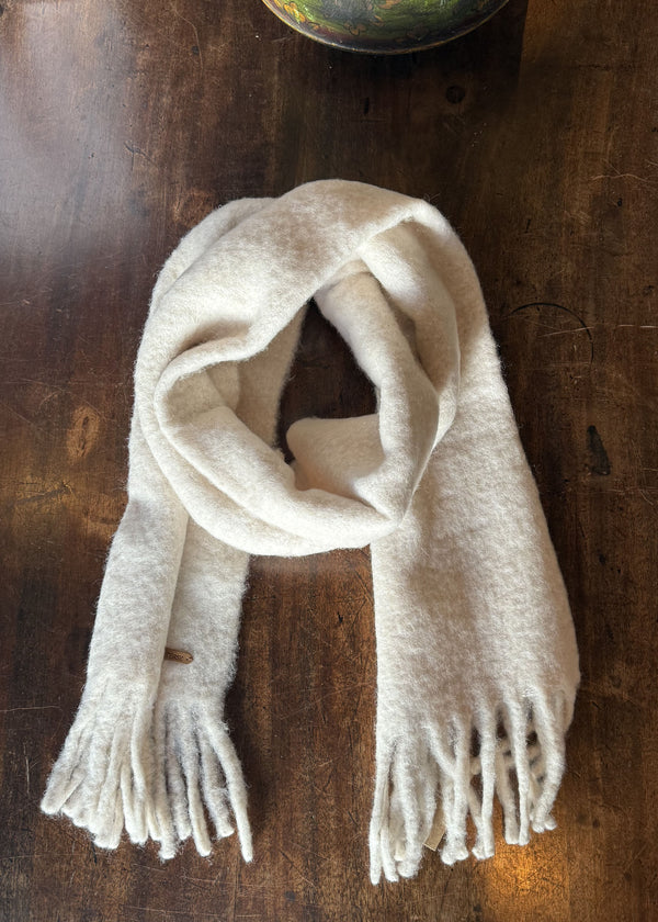 White scarf on a wooden table