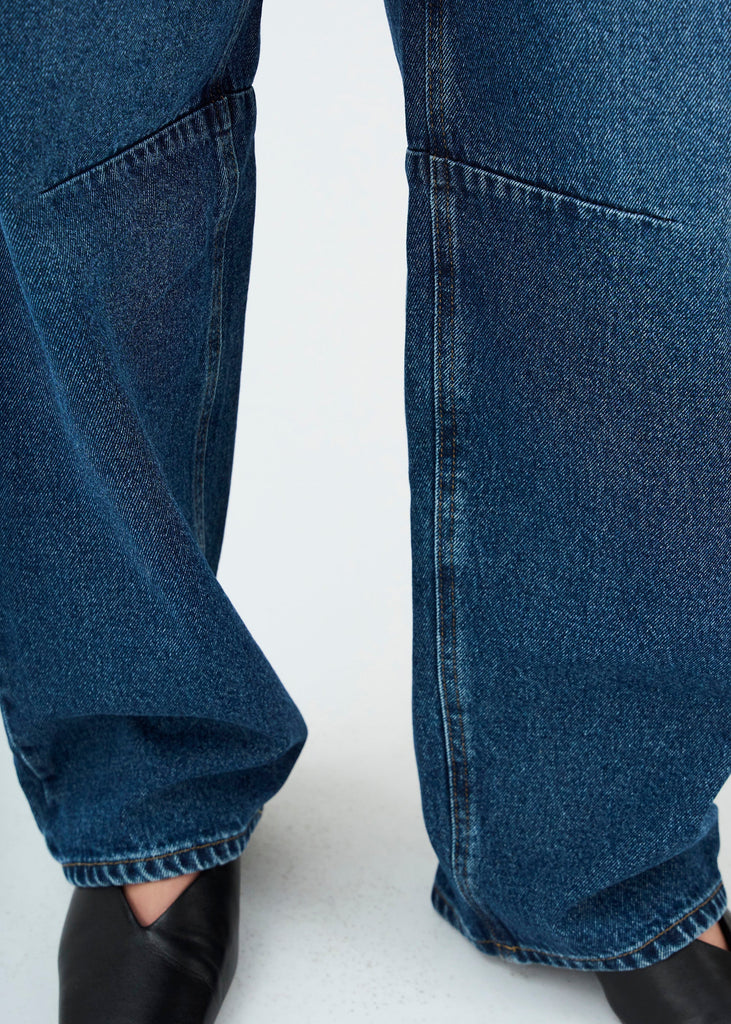Close-up of blue jeans on a white background