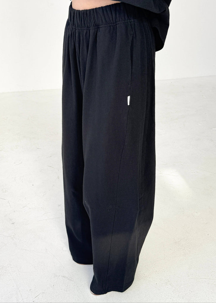 Black wide-leg pants on a white background
