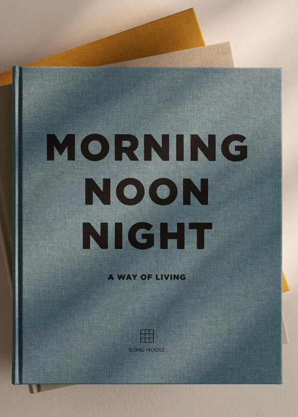 Book titled 'Morning Noon Night: A Way of Living' on a textured surface