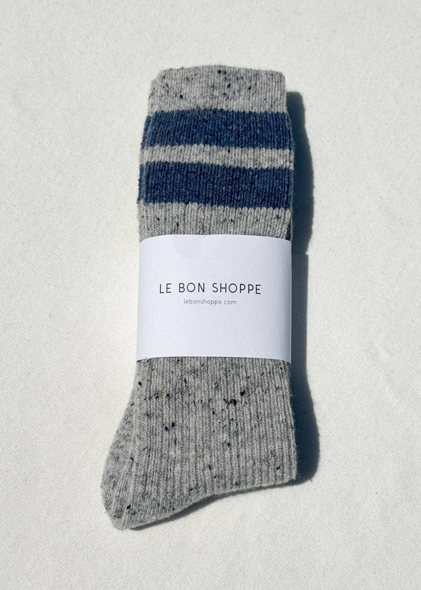 Gray and blue striped sock with a label on a light gray background