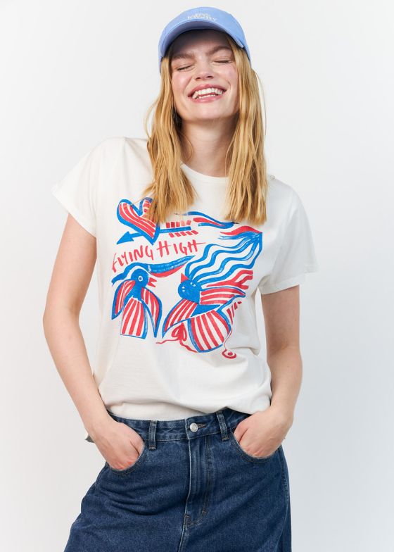The Lolly's Laundry Roma Tee is a classic T-shirt made from soft cotton with an artistic, graphic print. The motif with red and blue details