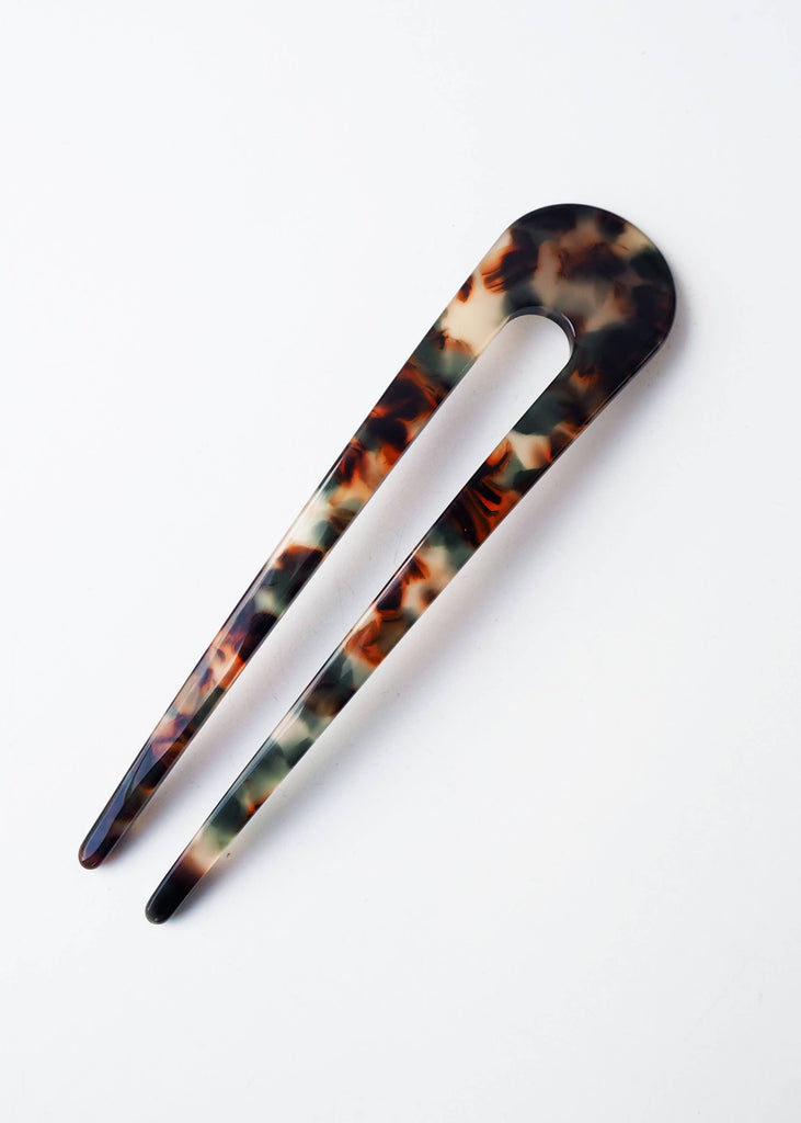 Tortoiseshell hair clip on a white background