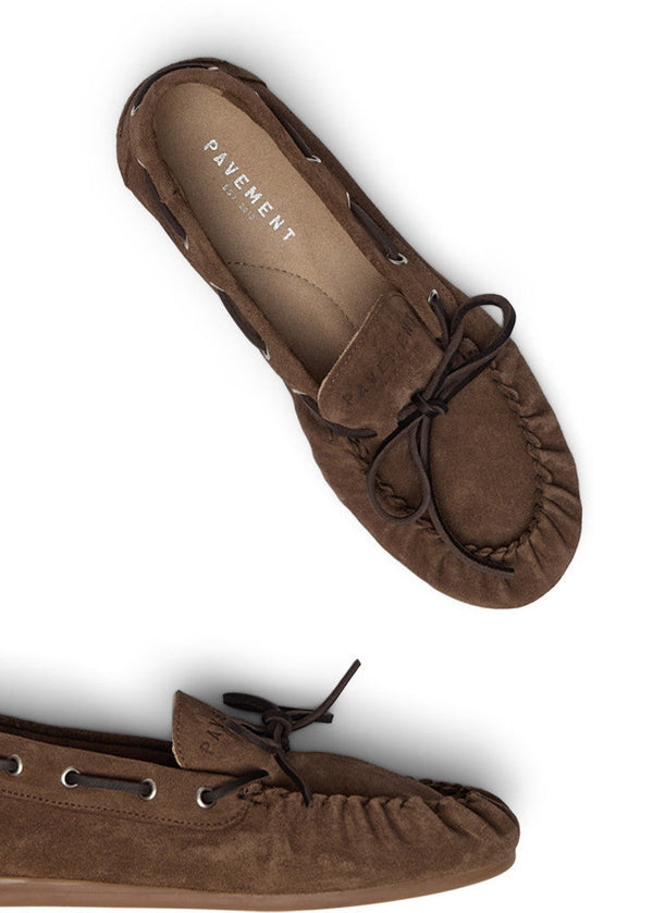 Brown suede loafers on a white background