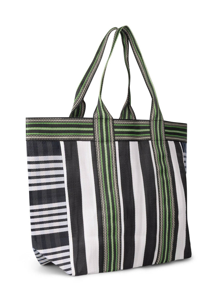 Striped tote bag with green, black, and white pattern on a white background