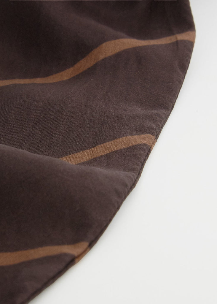 Brown fabric with striped pattern on a white background