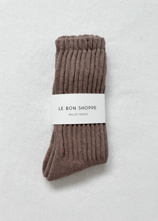 Pair of brown ballet socks with a 'Le Bon Shoppe' label on a light gray background