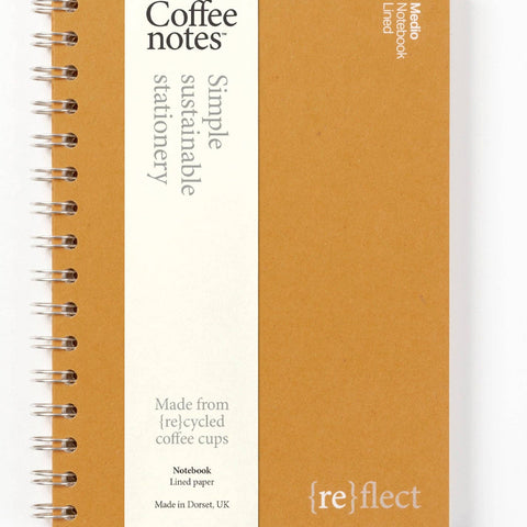 Sustainable notebook made from recycled coffee cups with visible branding on a white background