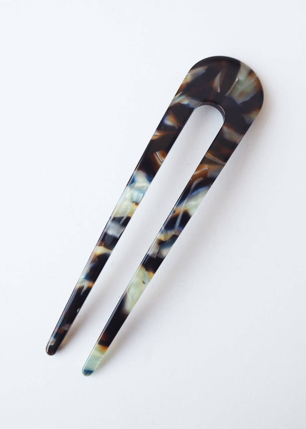 Tortoiseshell hair clip on a white background