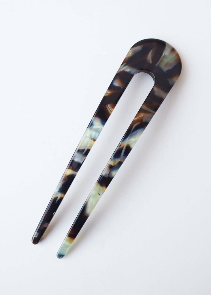 Tortoiseshell hair clip on a white background