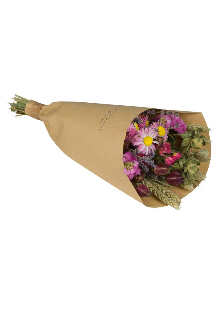 Bouquet of flowers wrapped in brown paper on a white background
