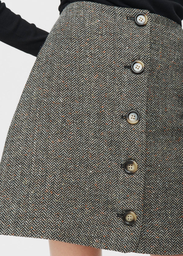 Gray herringbone skirt with button details on a white background