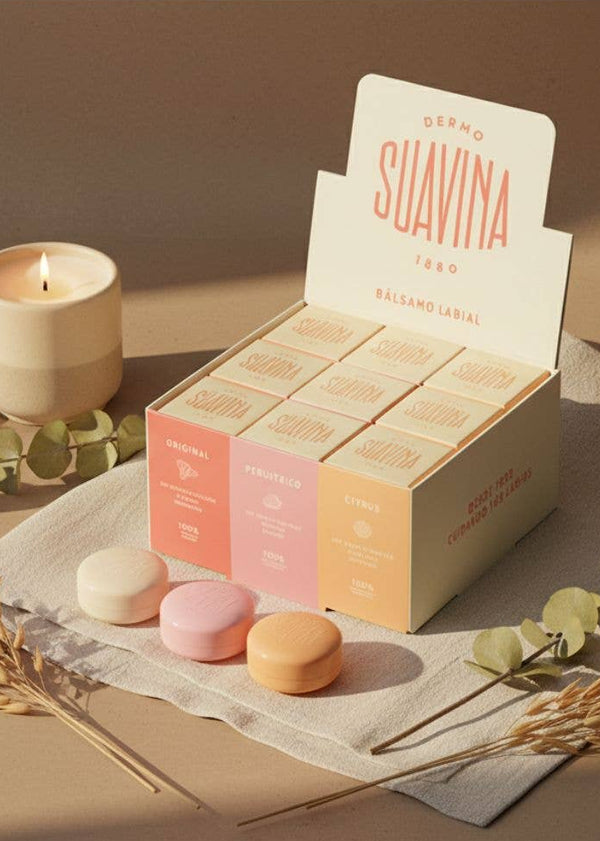 Box of Suavina products on a table with a candle and cup of coffee in the background