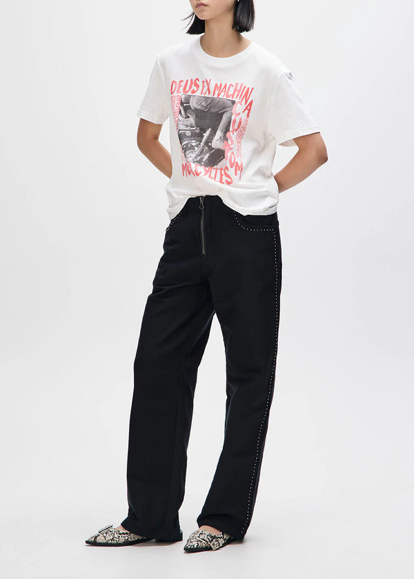 Person wearing a white t-shirt with red text and black pants on a white background