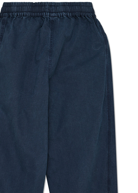 Navy blue pants with an elastic waistband on a white background