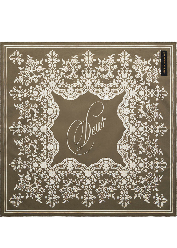 Decorative brown mat with white lace pattern and 'Sews' text on a white background