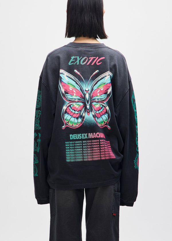 Person wearing a black sweatshirt with a colorful butterfly design and text on a plain background