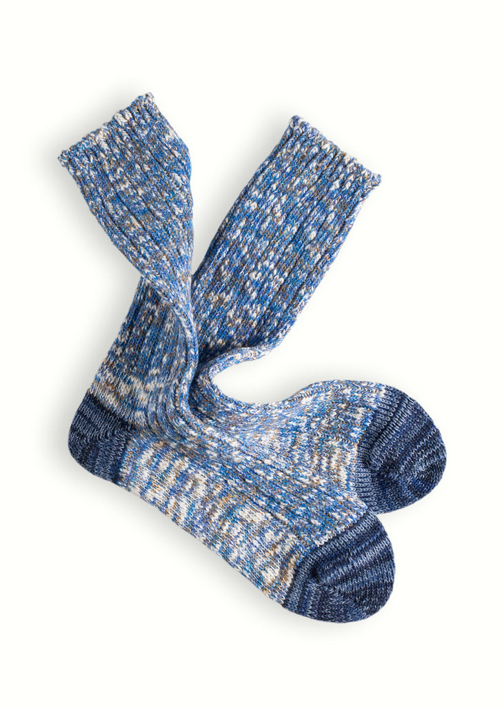 Pair of blue and gray patterned socks on a white background
