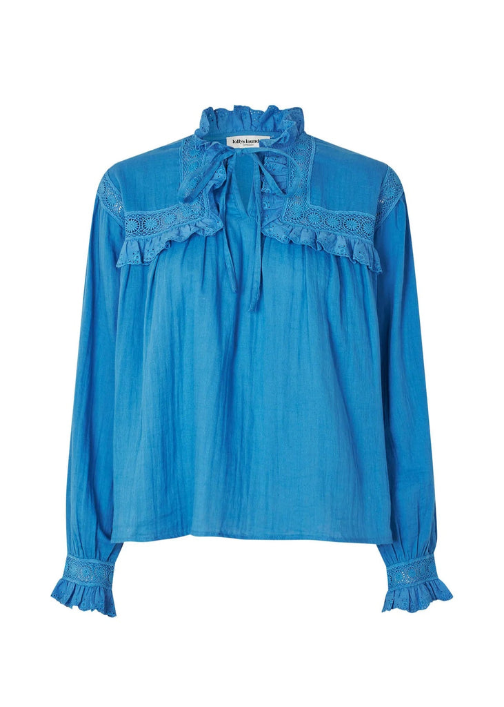 Blue blouse with lace details on a white background