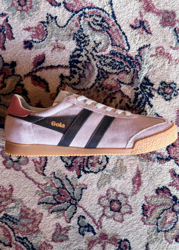 Sneaker with Gola logo on a patterned rug