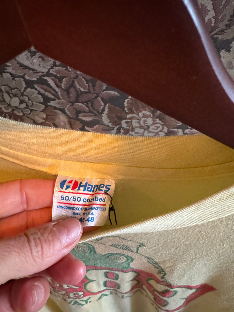 Hanes tag on a piece of fabric with a floral pattern in the background