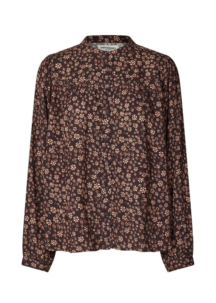 Floral patterned blouse on a white background