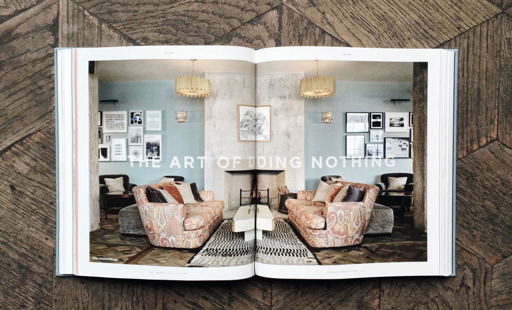 Open book showing a living room interior with 'The Art of Doing Nothing' text.