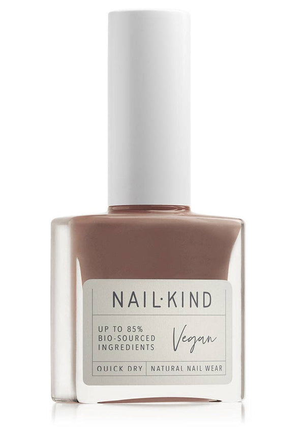 Nail polish bottle with 'Nail Kind' label on a white background