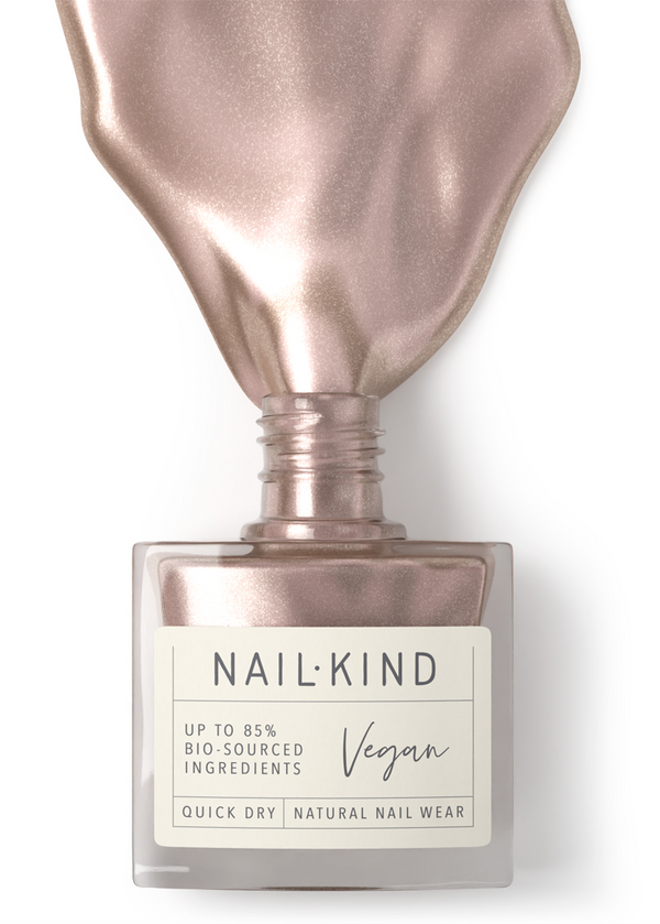 NailKind nail polish bottle with rose gold cap on a white background