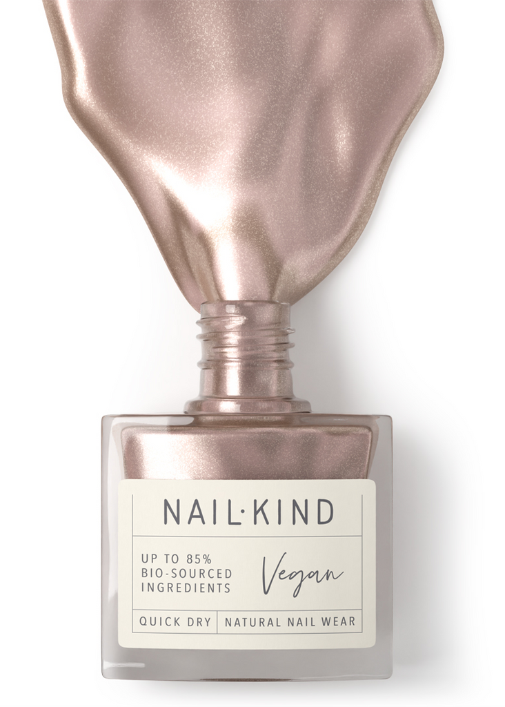 NailKind nail polish bottle with rose gold cap on a white background