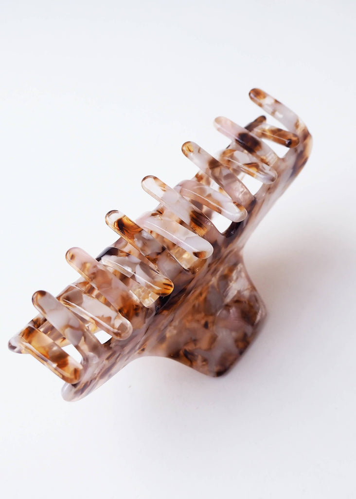 Tortoiseshell hair clip on a white background