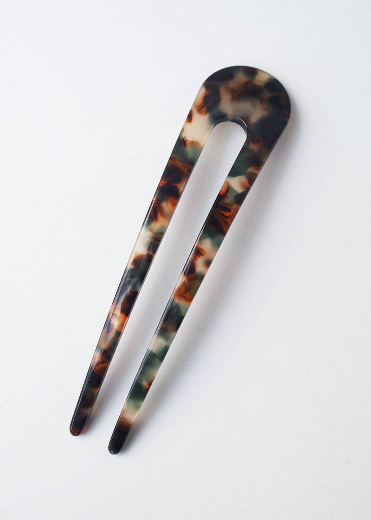 Tortoiseshell hair clip on a white background