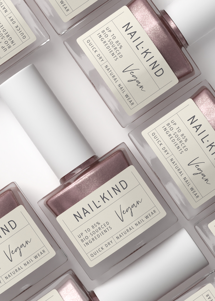 NailKind vegan nail polish bottles arranged on a light background