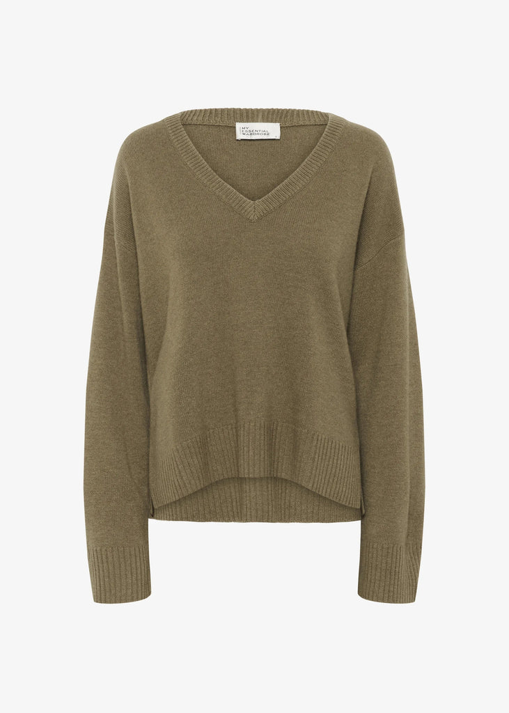 Green sweater on a white background