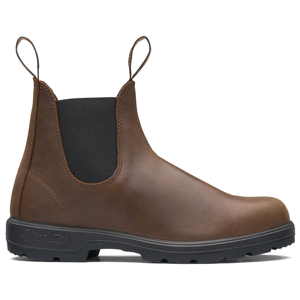 Brown leather Chelsea boot with black sole on a white background