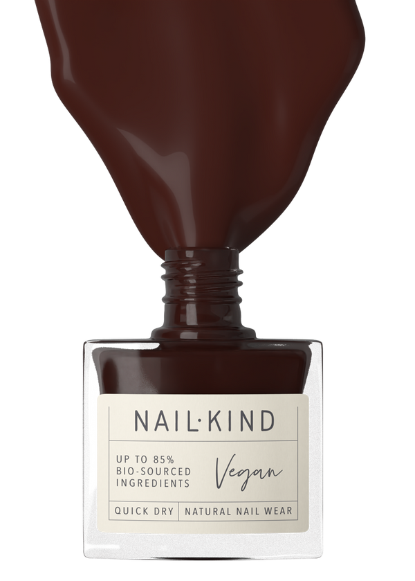 Nail polish bottle with 'Nail-Kind' label on a white background