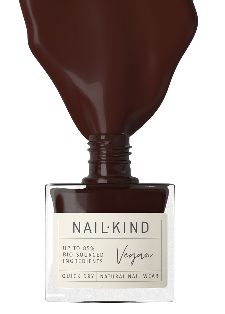 Nail polish bottle with 'Nail-Kind' label on a white background