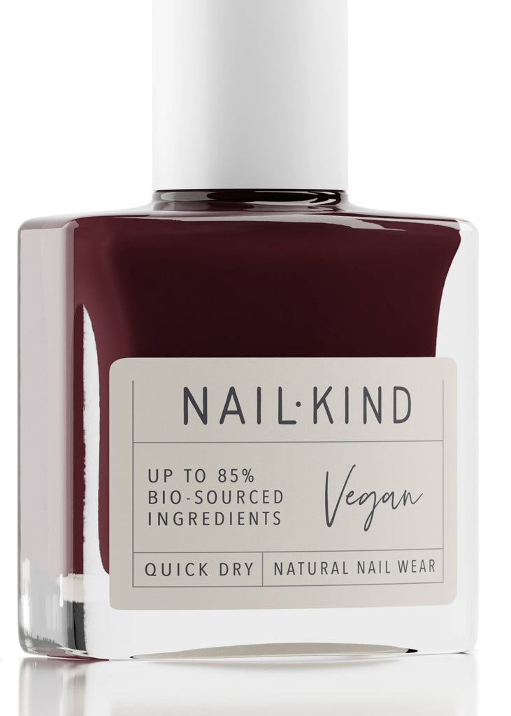Nail polish bottle with 'NAIL:Kind' label on a white background