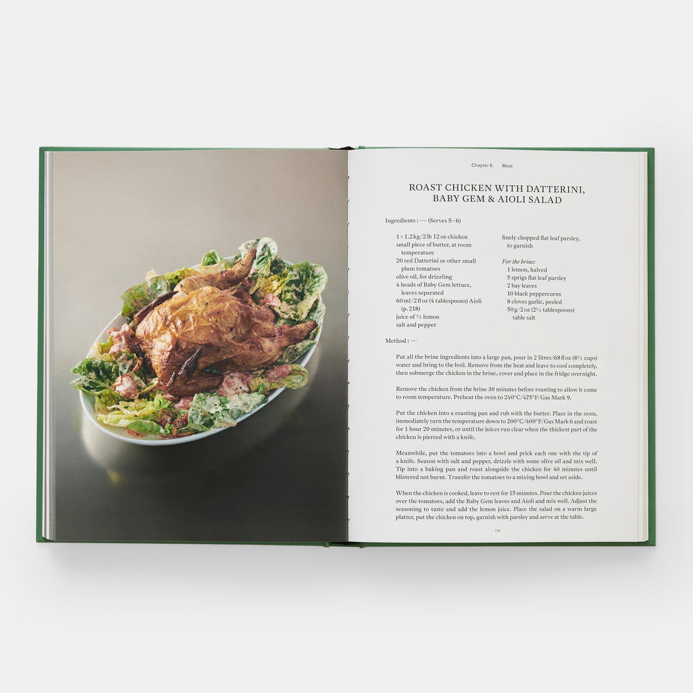 Open cookbook showing a recipe for roast chicken with salad