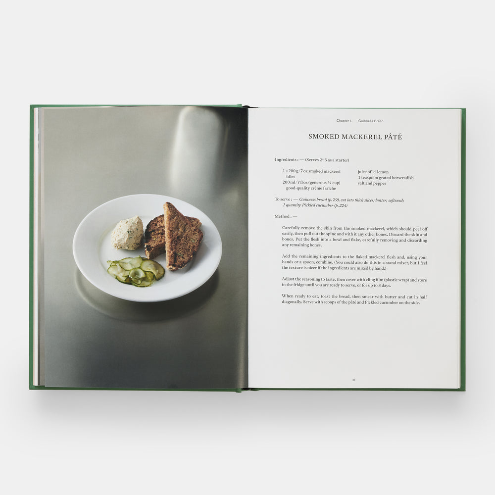 Open book showing a plate of food and text on a white background