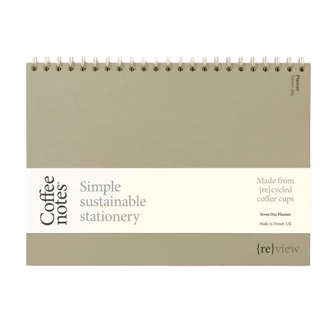 Sustainable stationery planner made from recycled coffee cups on a white background