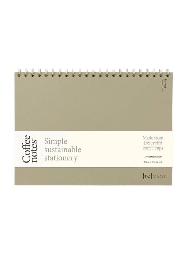 Sustainable stationery planner made from recycled coffee cups on a white background