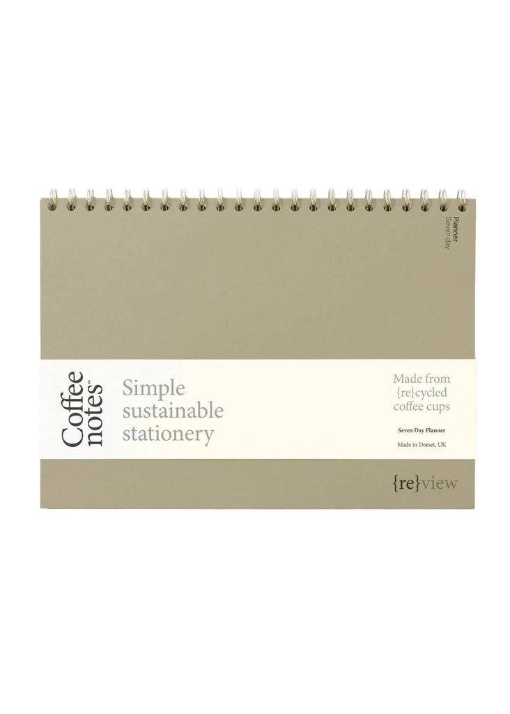 Sustainable stationery planner made from recycled coffee cups on a white background