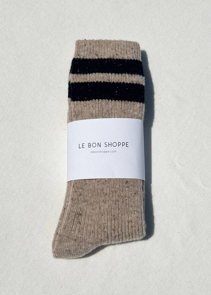 Beige sock with black stripes on a white background, featuring 'Le Bon Shoppe' label.