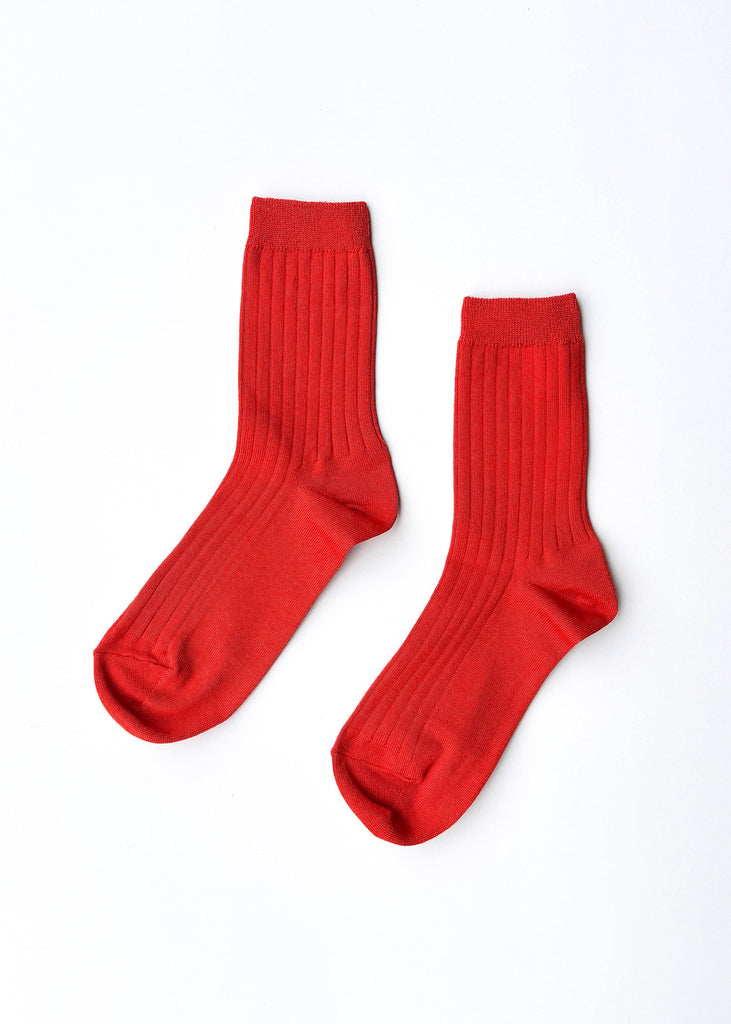 Pair of red socks on a white background